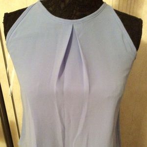 Purple sleeveless blouse with lace bottom detail